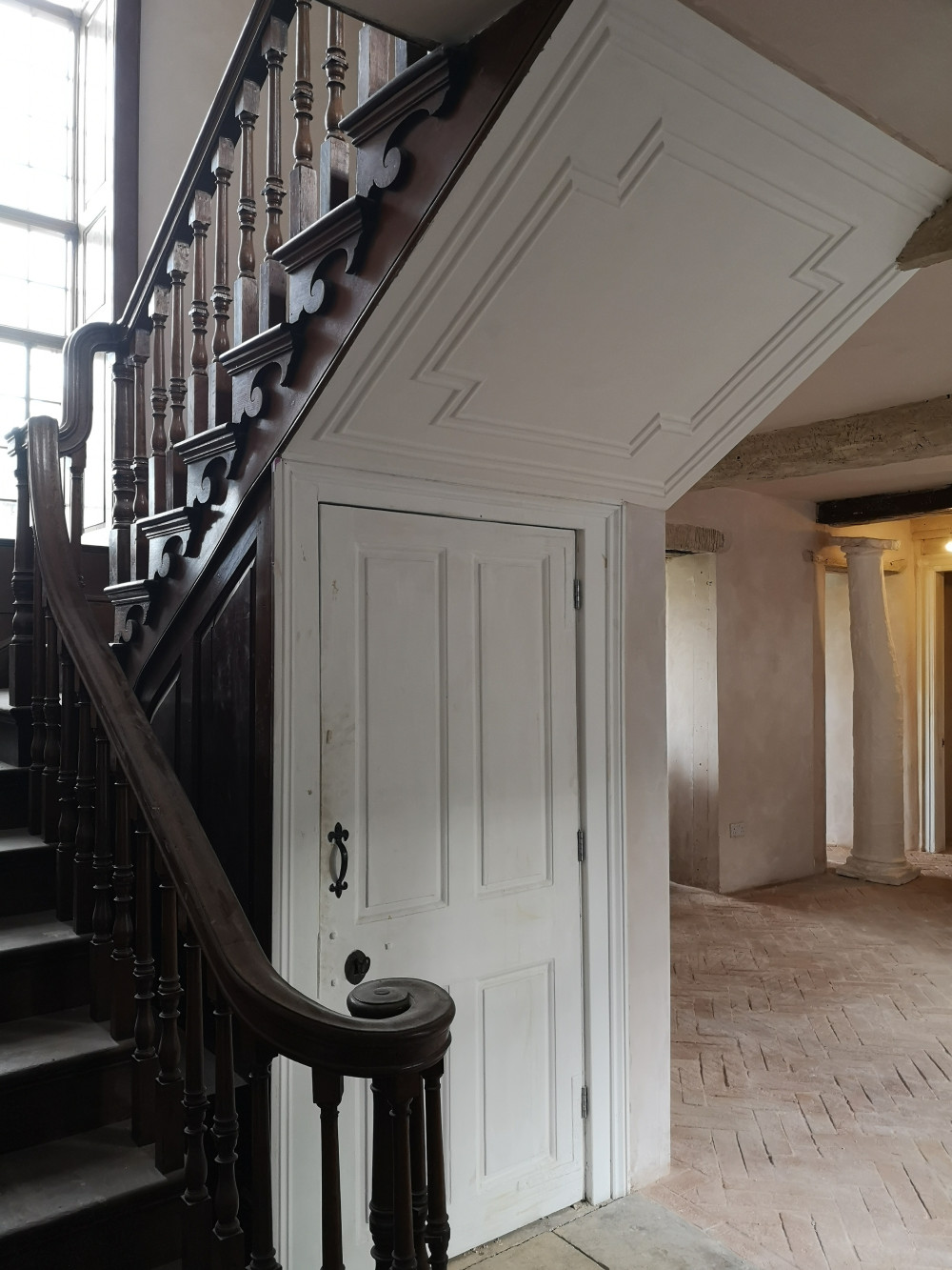 Detail added to the sloping ceilings below staircase
